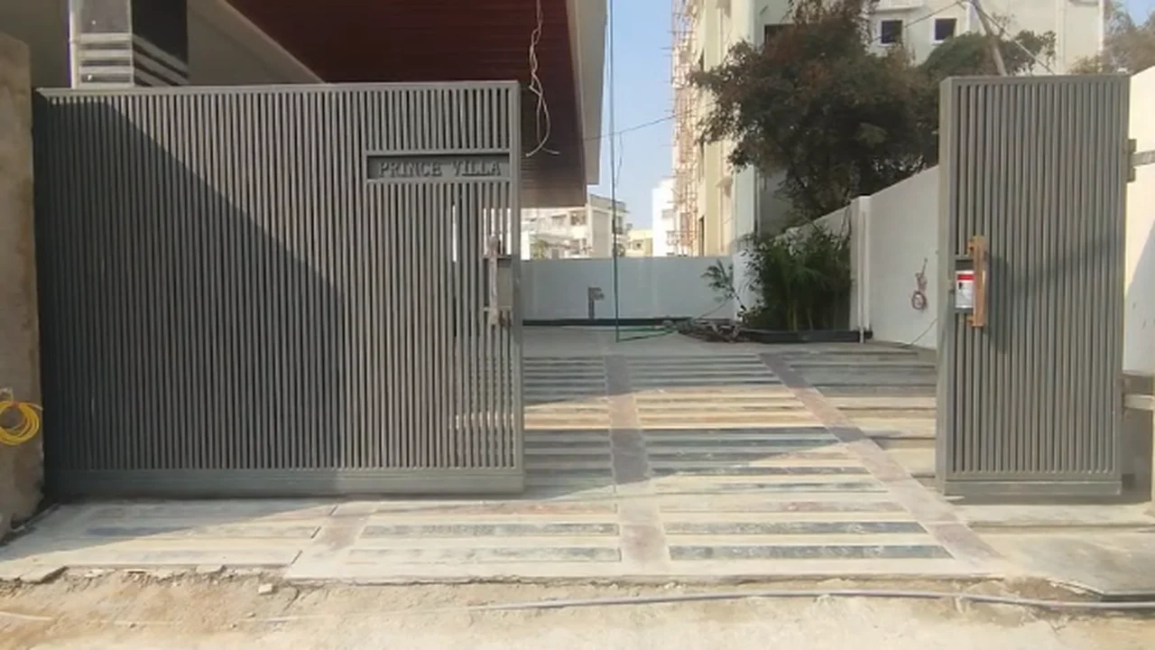 Modern slatted villa entrance gate in Hyderabad